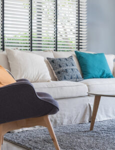 blue living room with white sofa and blue accent chair