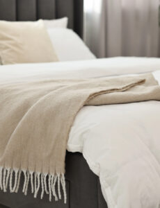 pillows and blankets on bed