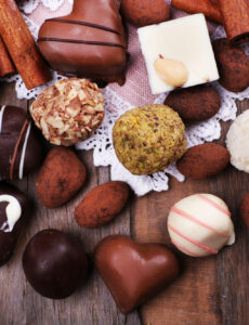 chocolates of all kinds on a wood table