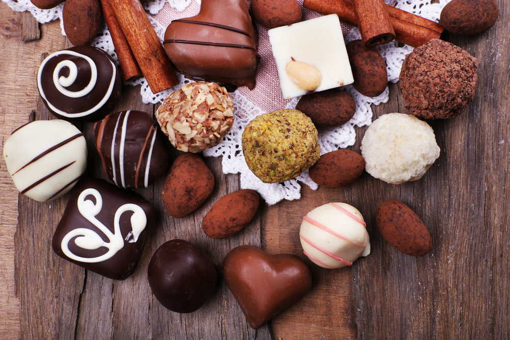 chocolates of all kinds on a wood table