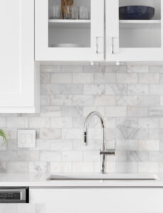 white kitchen cabinets with backsplash