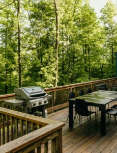 a beautiful deck overlooking a wooded yard