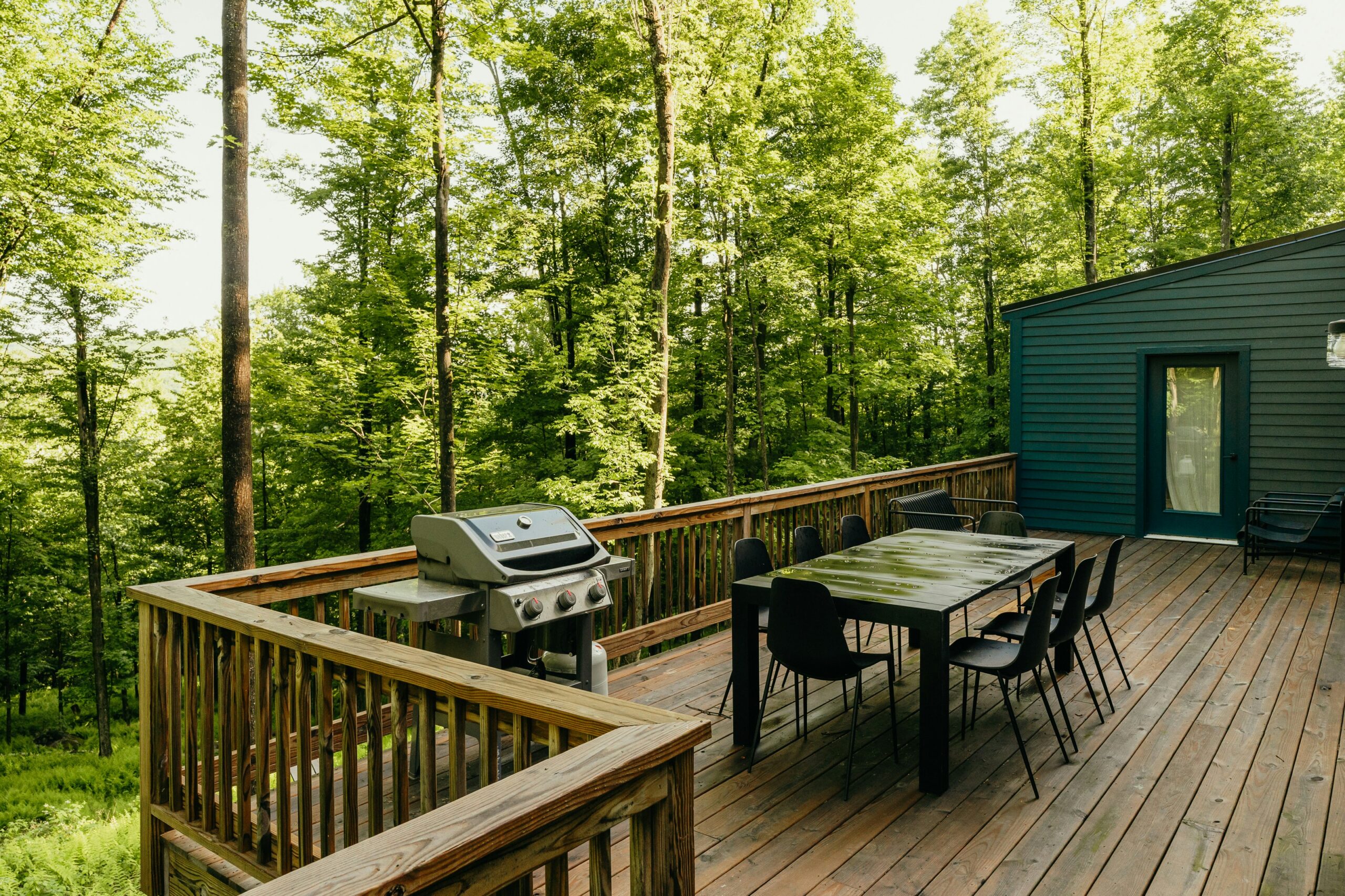 a beautiful deck overlooking a wooded yard