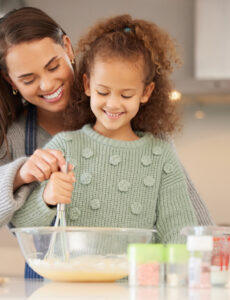 parent and child baking together