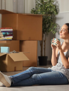 woman, apartment, moving boxes, dog