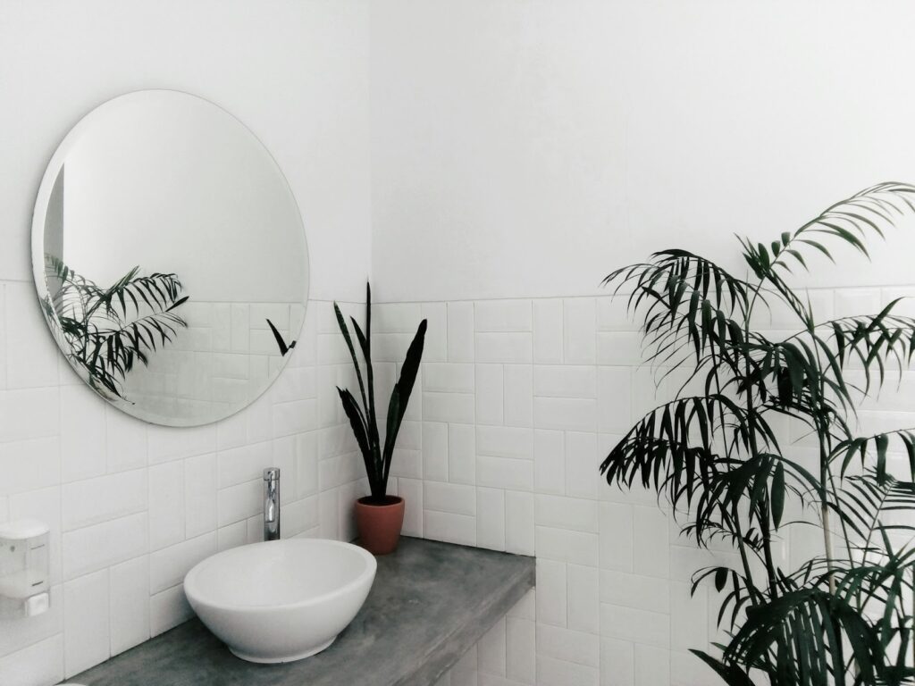 frameless mirror in modern bathroom