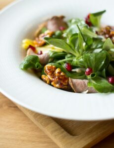 healthy green salad, nuts