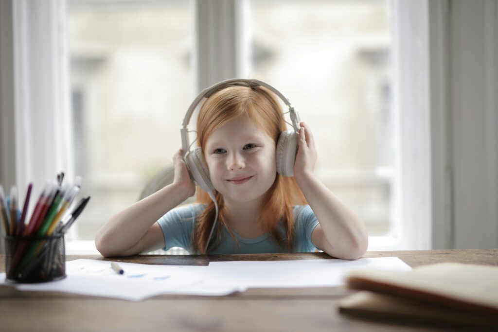 kid, earphones, homework