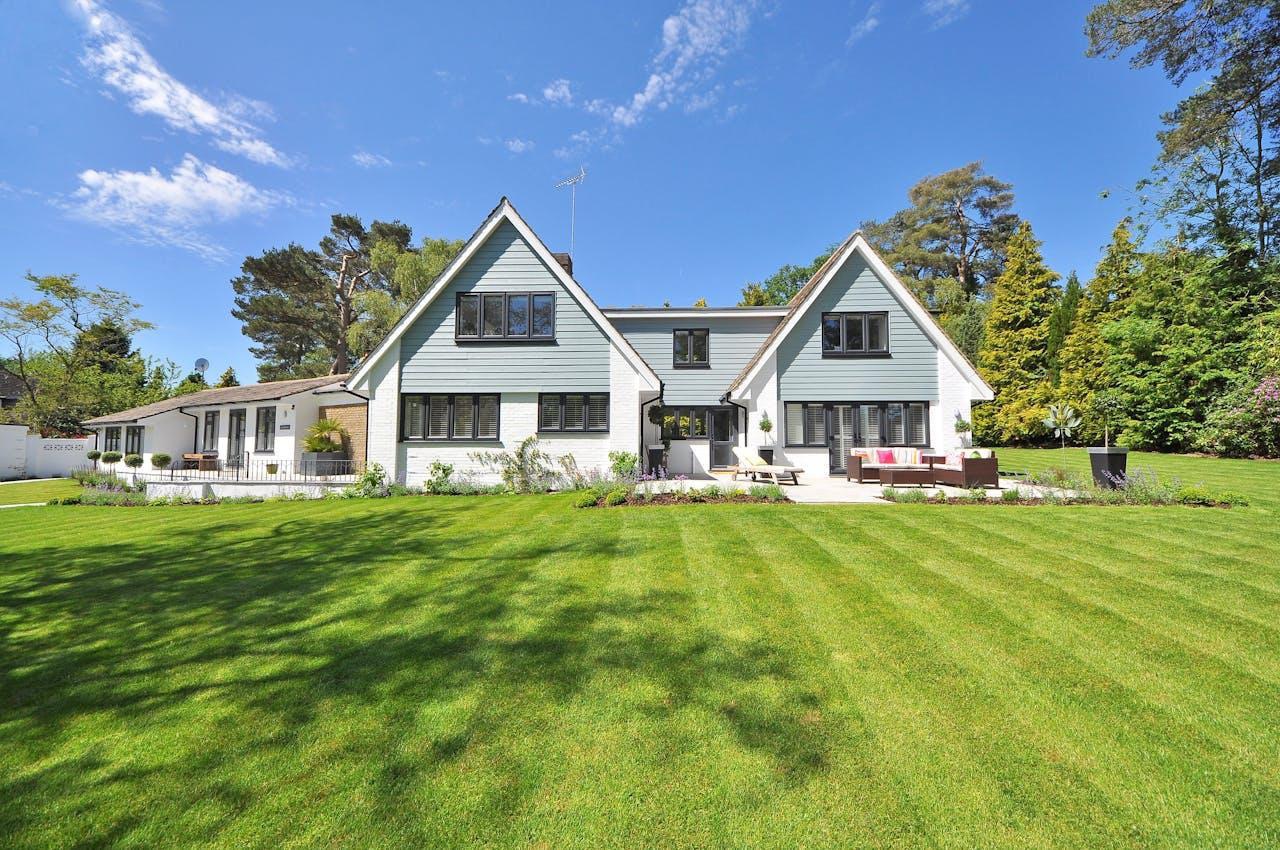 beautiful home, green lawn, trees