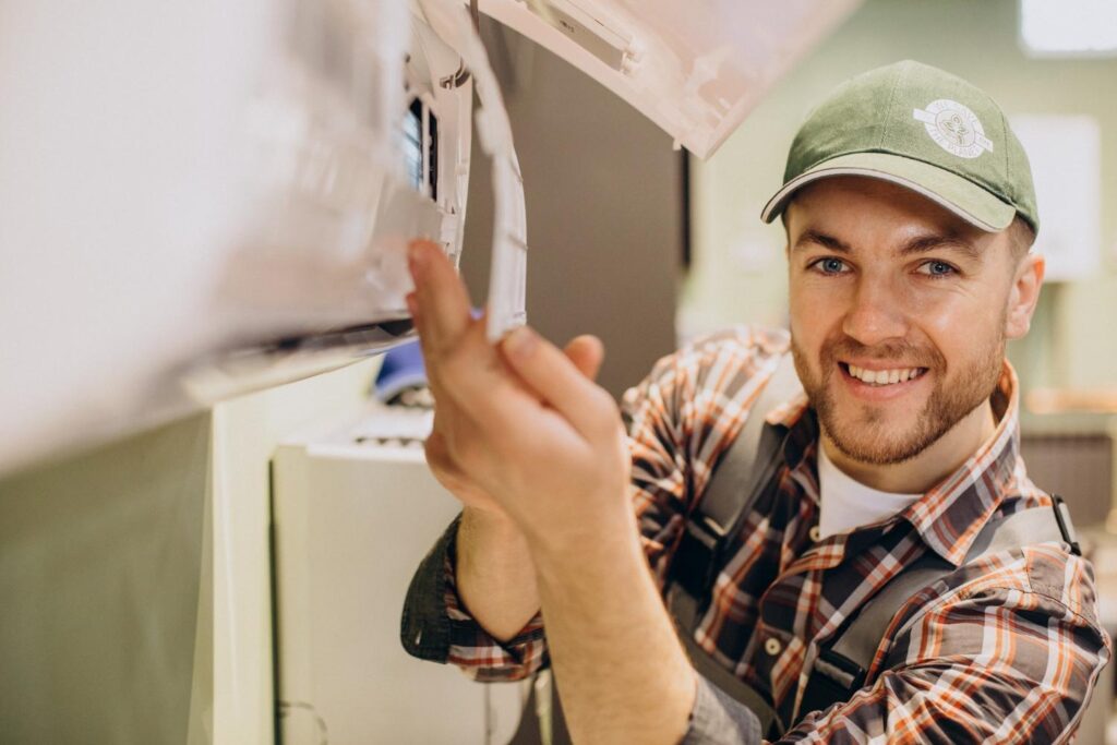 technician fixing and air conditioning unit