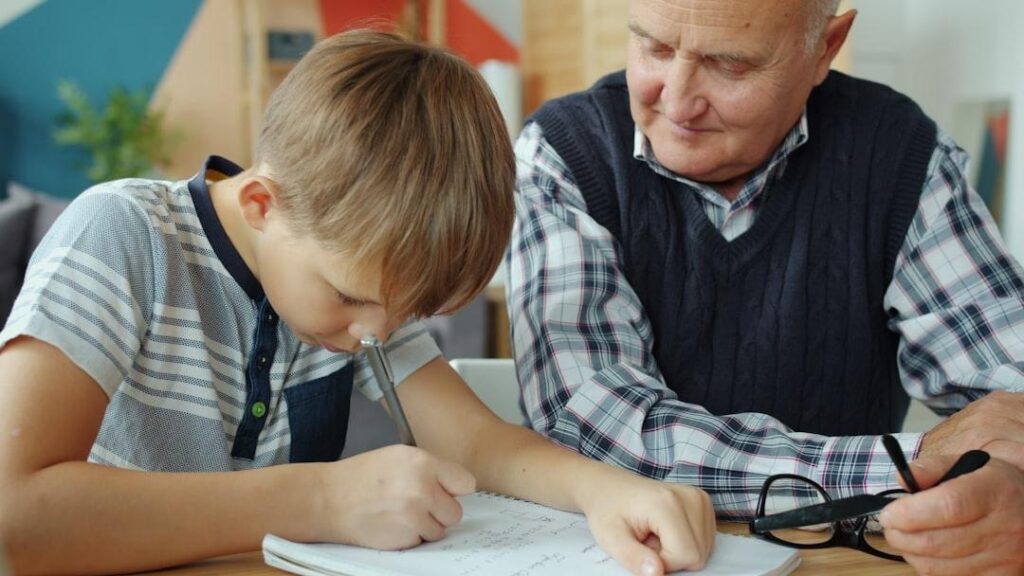 An adult child helping an older parent with paperwork