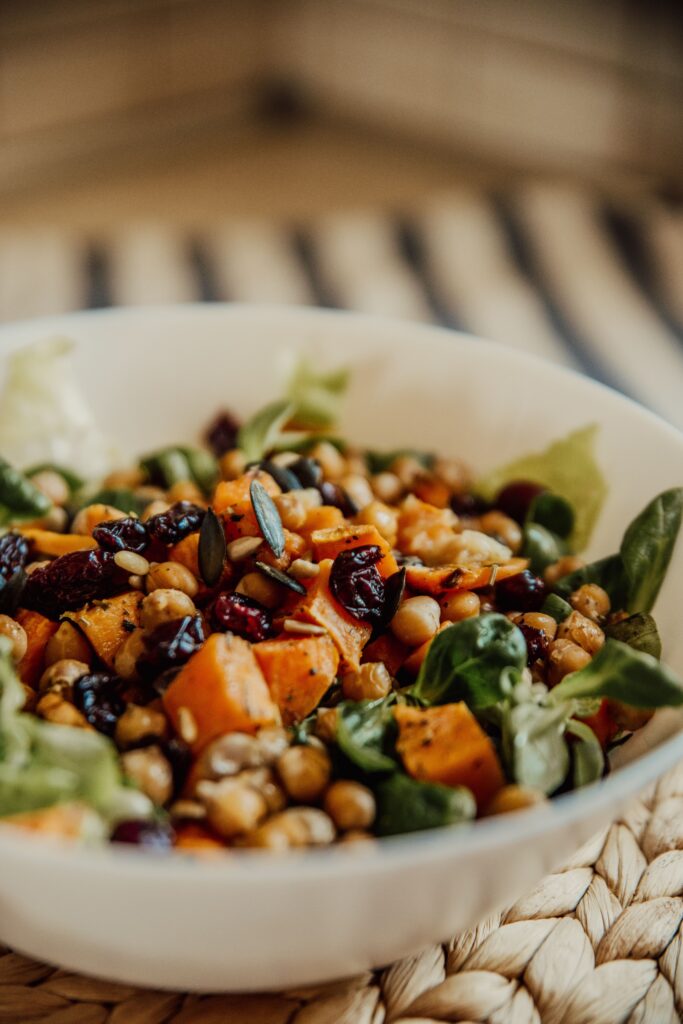 a bowl full of beans and vegetables for a healthy meal full of fiber