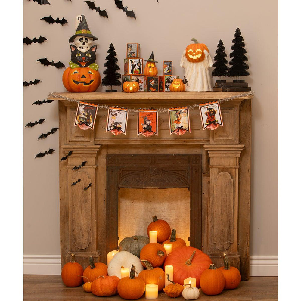 A fireplace mantel decorated for Halloween