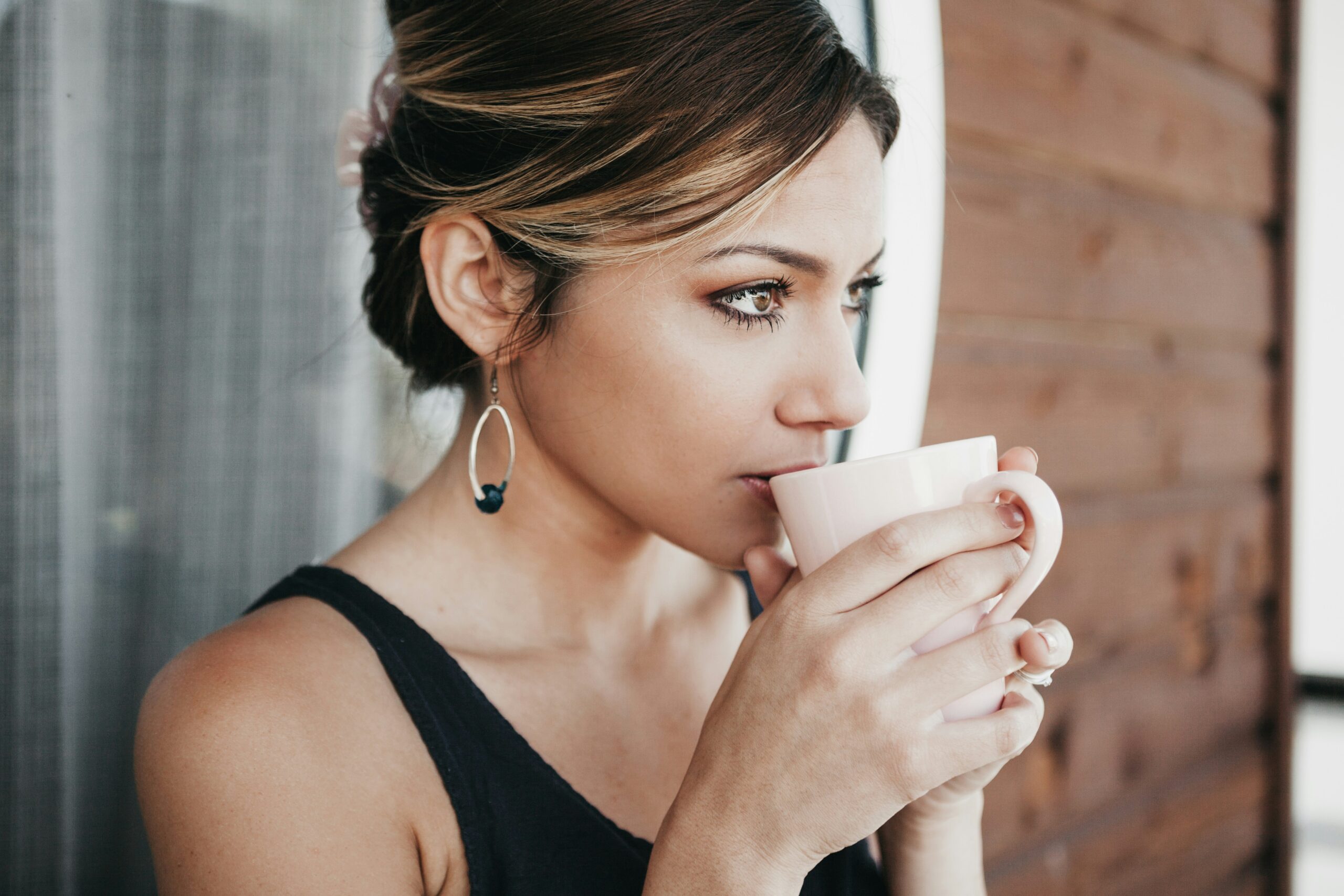 woman sipping coffee