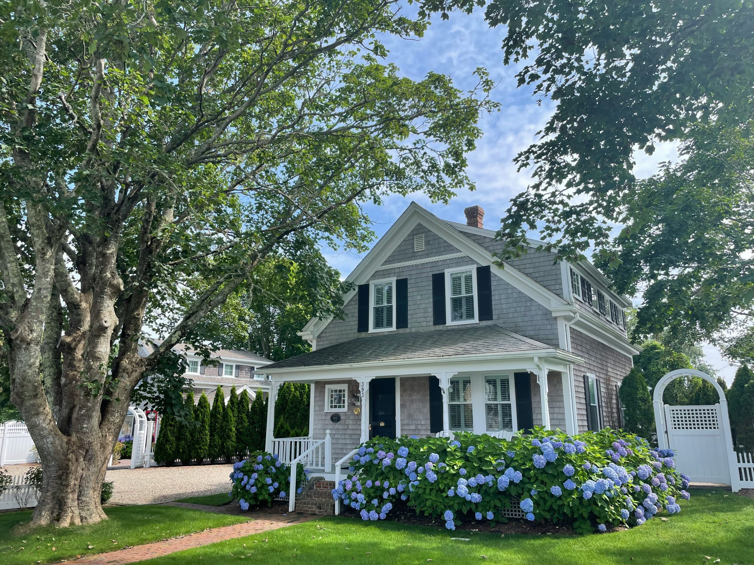 beautiful older home with gorgeous landscaping