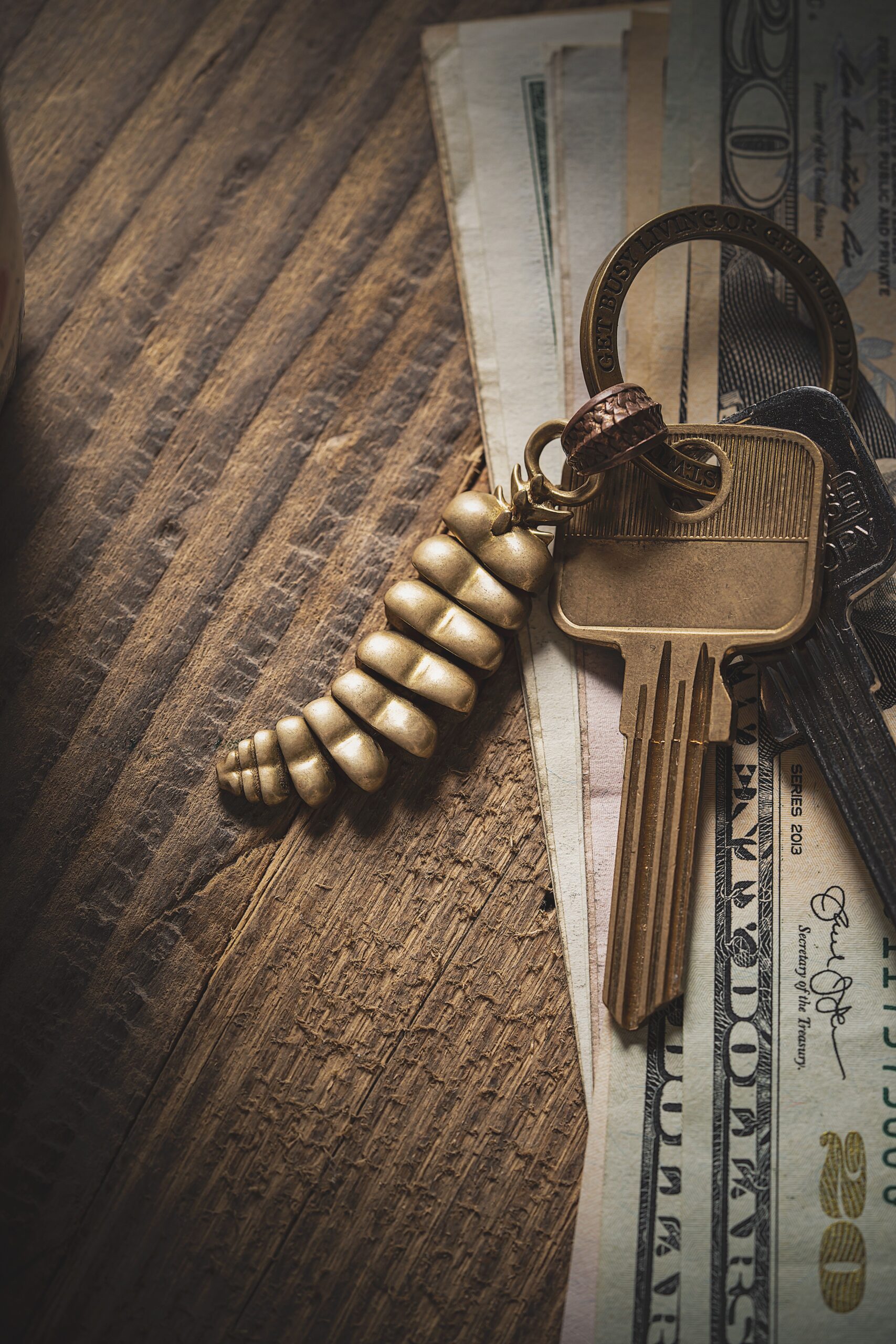 cash with a key on top of it