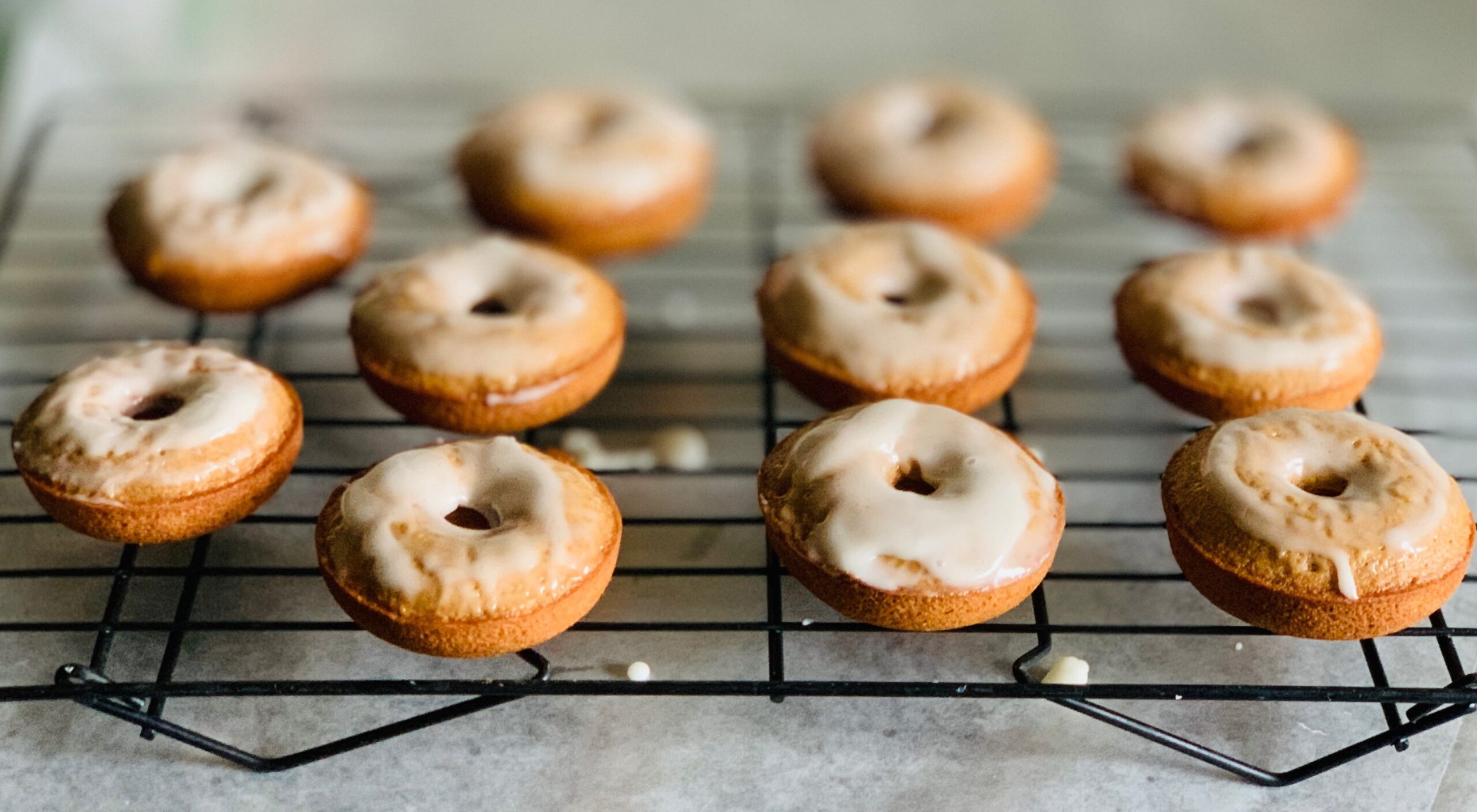 apple cider donuts on a wire cooling rack